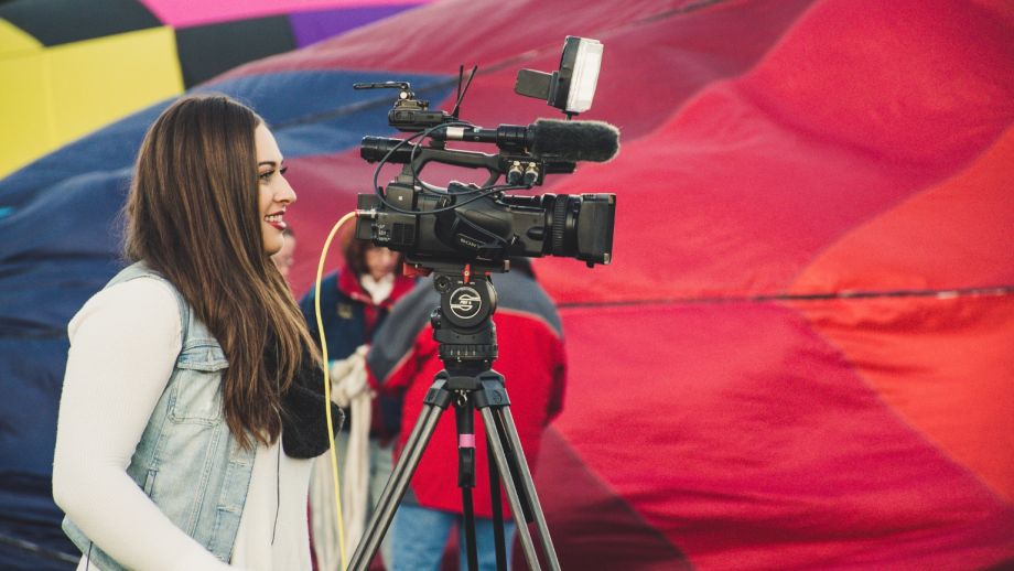 Media Professional working an event with large camera equipment.