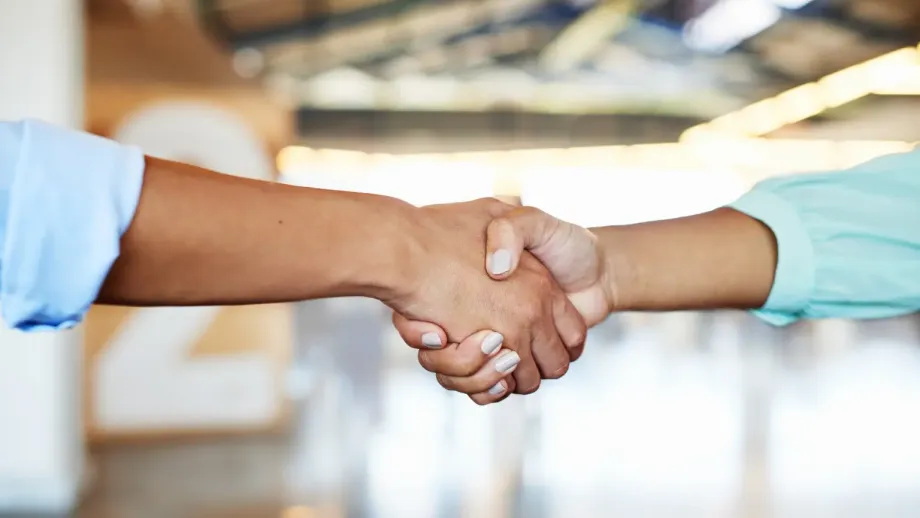 Alioup professionals shaking hands.