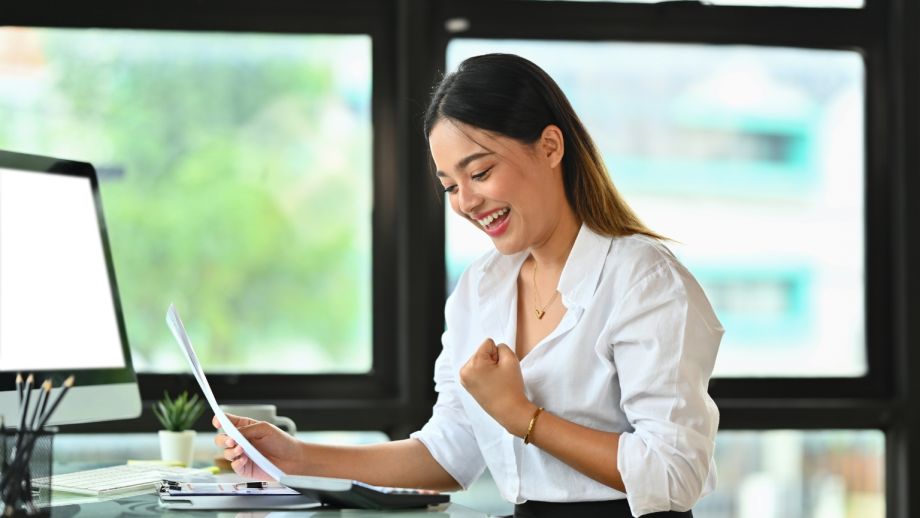 Smiling, successful small business owner.